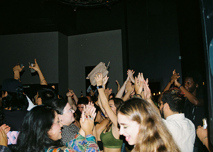 A group of women enjoying a lively social gathering, celebrating changes women stopped pretending to like after 30.