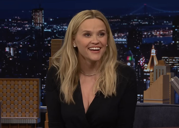 Actress smiling during a late-night talk show interview discussing people who knew celebrities before fame.