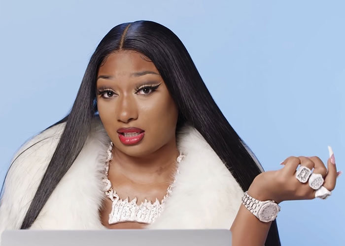 Young woman with long black hair wearing a white fur coat and jewelry, sharing stories about people who knew celebrities before fame.