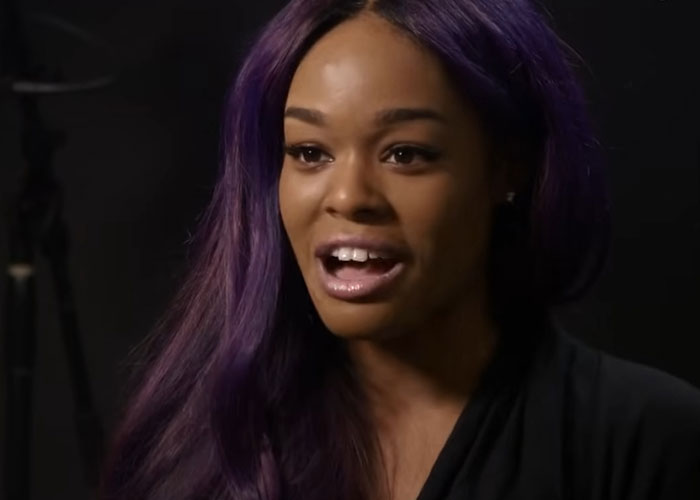 Woman with long purple hair speaking in an interview about people who knew celebrities before fame and their true personalities.