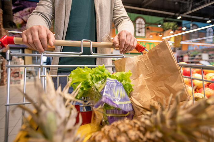 Woman shopping at store with cart full of groceries, highlighting lesson learned after almost getting scammed. Woman shopping at store with cart full of groceries, highlighting lesson learned after almost getting scammed.
