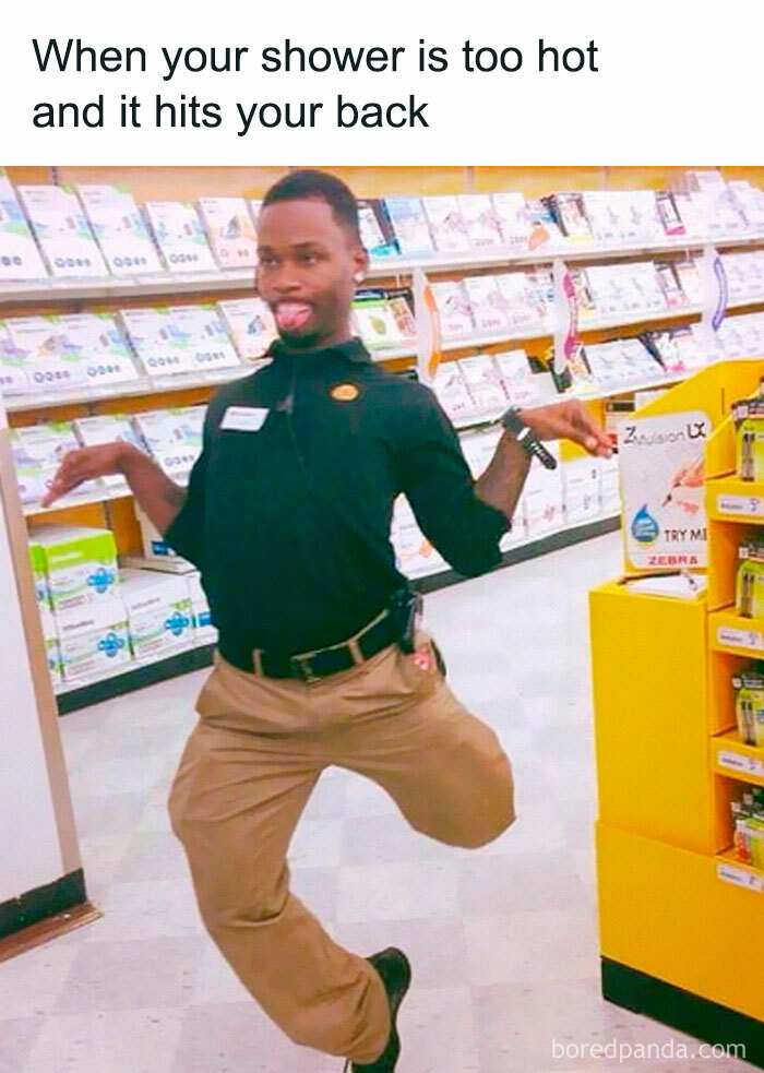 Man in work uniform making a funny pose in store aisle, meme about hot shower hitting your back, random memes humor.