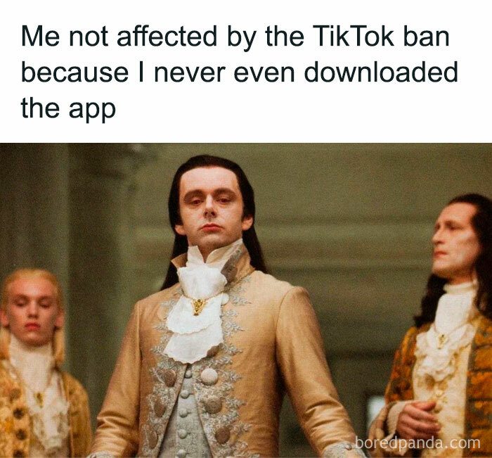 Man in vintage attire confidently standing with caption about not being affected by TikTok ban, a random meme for brain break.