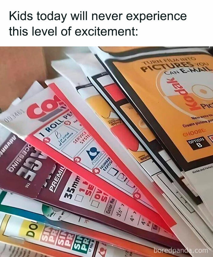 Stacks of vintage 35mm film rolls and picture packets illustrating nostalgia in random memes for a brain break.