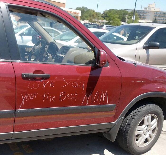 Red car with a scratched message saying love you your the best mom, a random meme for when your brain needs a break.