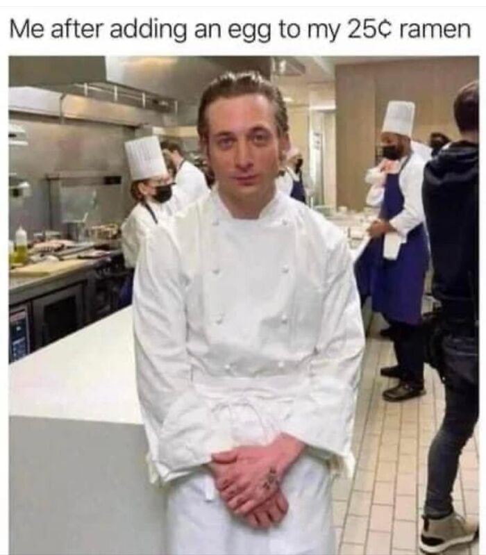 Man in chef uniform with a confident expression, captioned humorously about adding an egg to ramen, random memes for brain break.