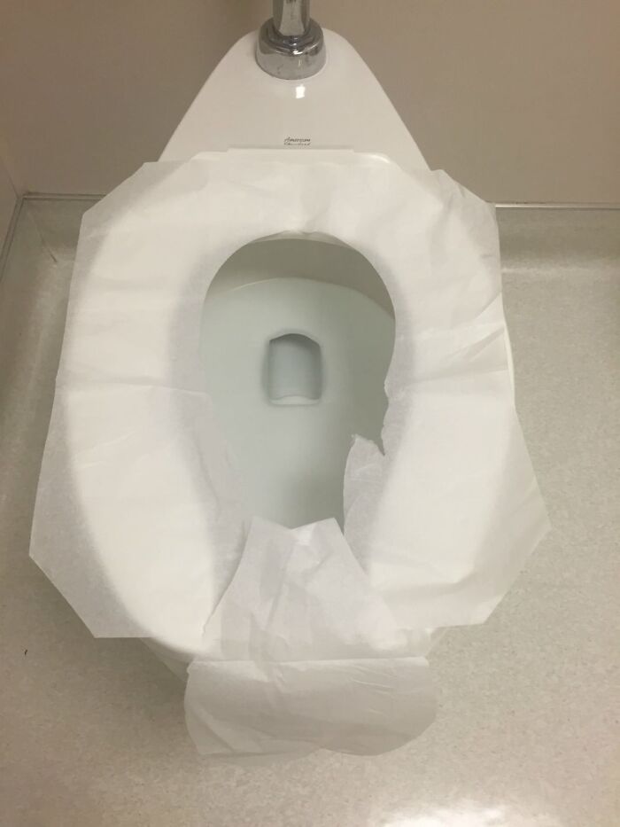 Toilet seat covered with a paper barrier illustrating a real-life example of the placebo effect in everyday situations.