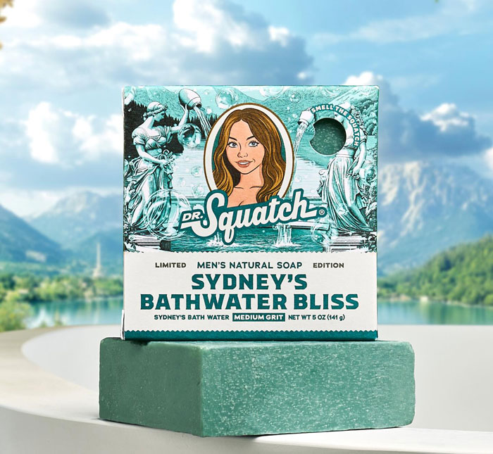 Soap bar and packaging labeled Sydney's Bathwater Bliss by Dr. Squatch, highlighting Sydney Sweeney bath water soap launch.