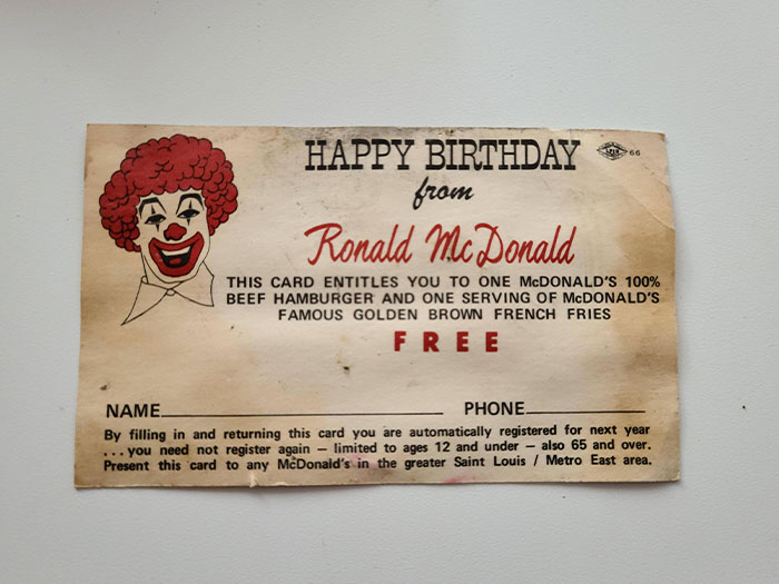 Vintage McDonald's birthday coupon from Ronald McDonald offering a free burger and fries, showing how things used to look.