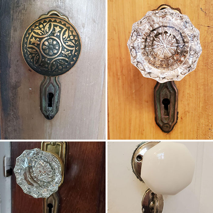 Four vintage doorknobs with intricate designs showcasing how things used to look in historical home decor.