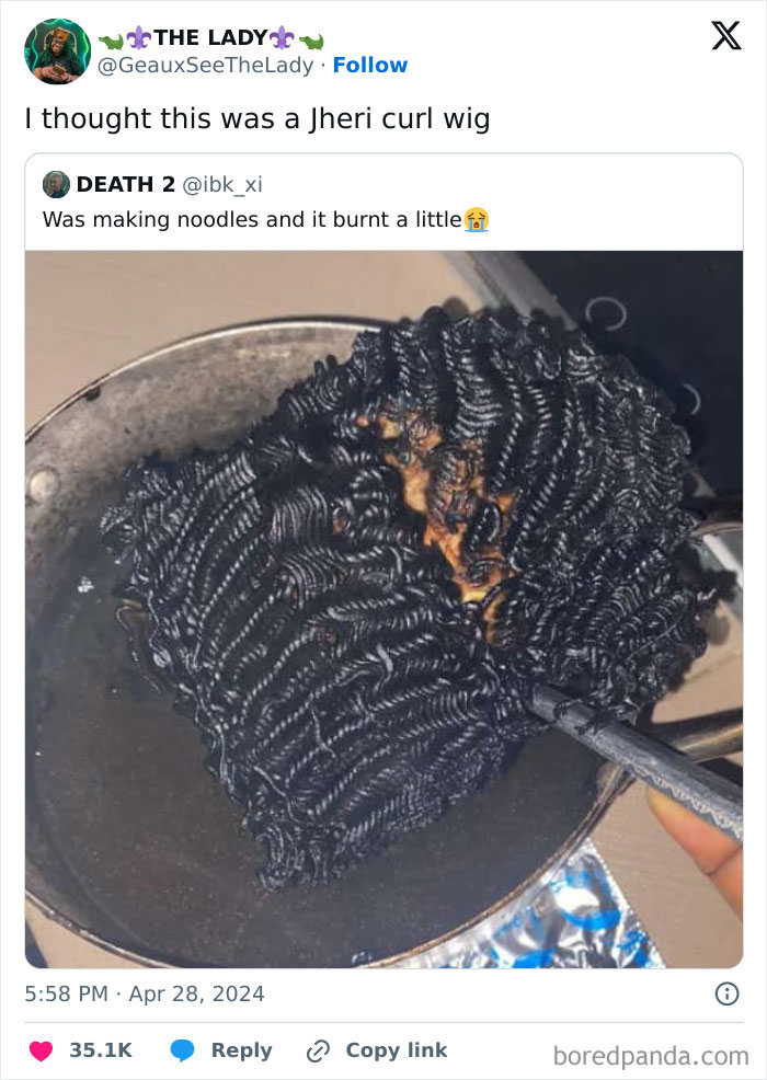 Burnt noodles in a pan that look like a Jheri curl wig, an interesting thing requiring a double take to realize.