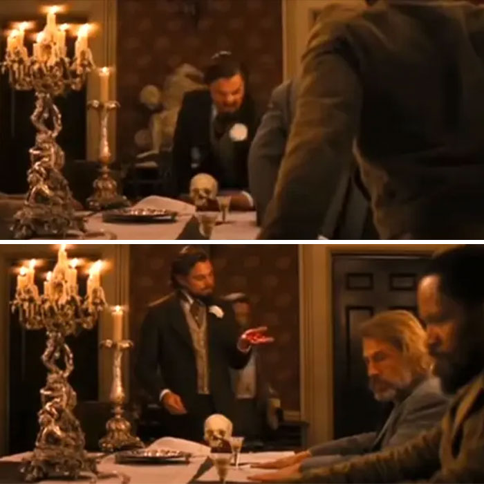 Scene from a movie showing actors performing a dramatic dining table sequence with vintage candleholders and props.