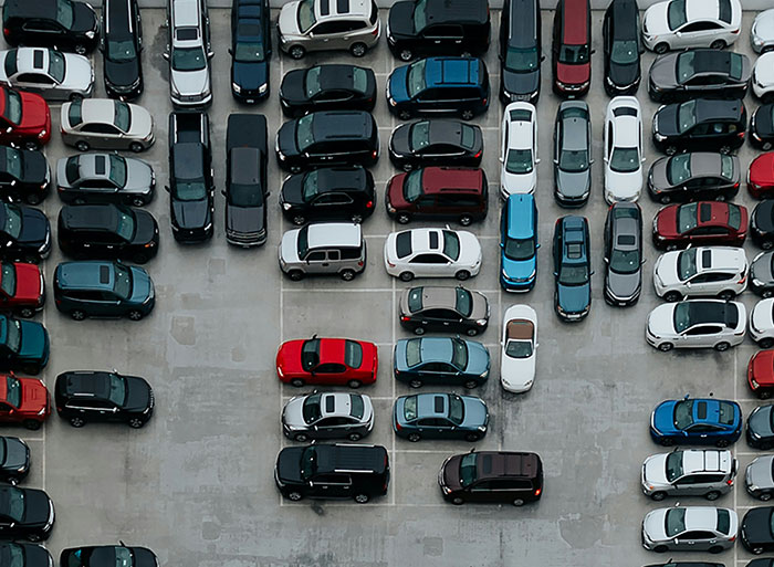 Aerial view of a crowded parking lot illustrating wild analogies healthcare workers use to explain medical problems.