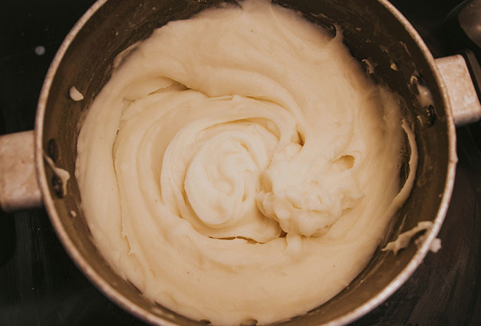 Close-up of creamy mashed potatoes in a pot, illustrating common cooking advice shared by many people.
