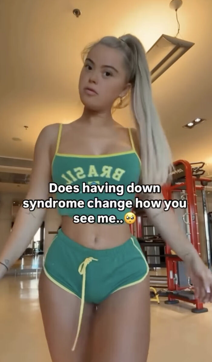 Young woman with Down syndrome in casual fitness attire, text overlay discussing social media trend backlash. Young woman with Down syndrome in casual fitness attire, text overlay discussing social media trend backlash.