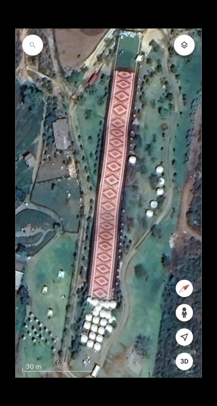 Aerial view of a patterned structure and surrounding landscape showing odd things found on Google Earth.
