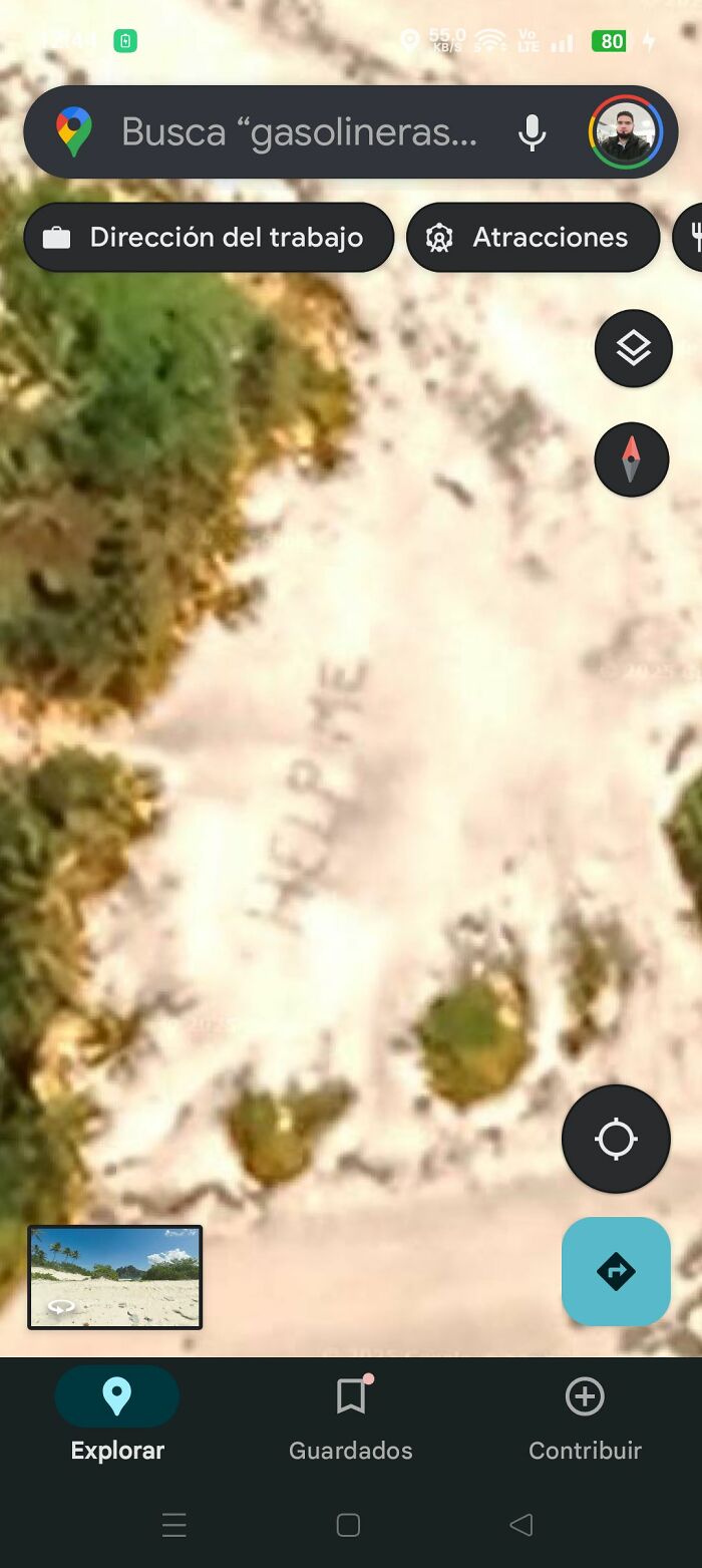 Satellite view on Google Earth showing the word HELP ME written in the sand, an odd discovery shared online.
