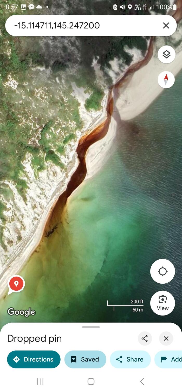 Aerial view of a strange shoreline with unusual river colors seen on Google Earth odd things discovery.