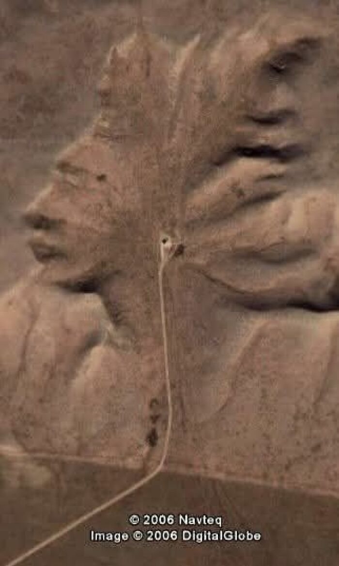 Aerial view of an odd rock formation resembling a Native American face captured on Google Earth.