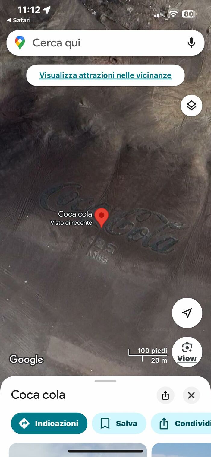 A large Coca Cola logo etched into a desert visible on Google Earth, an example of odd things found.