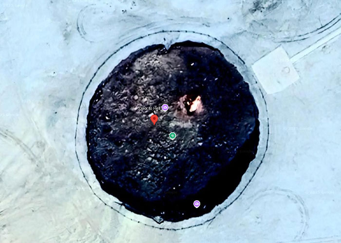 Aerial view of a large circular pit called Door to Hell, one of the weird things on Google Earth that sparks curiosity.
