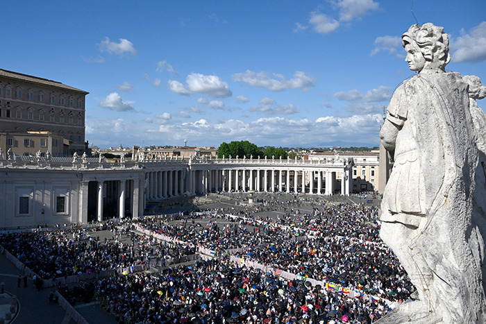 Crowd gathers in St. Peter&rsquo;s Square with white smoke signaling a new pope has been chosen during the papal conclave.