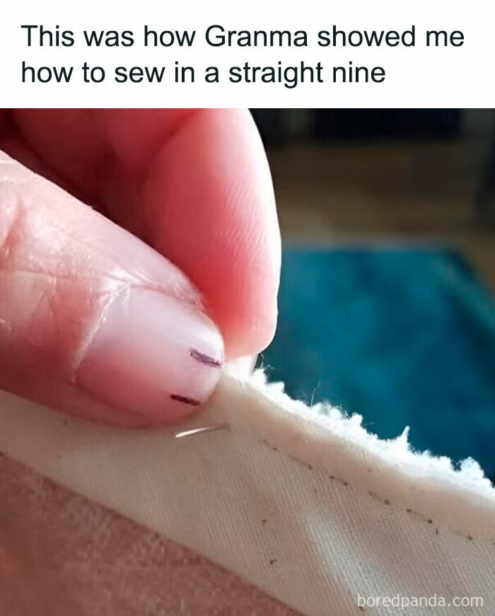 Close-up of a hand sewing fabric with a needle and marked lines, showing a wholesome meme moment about learning to sew.
