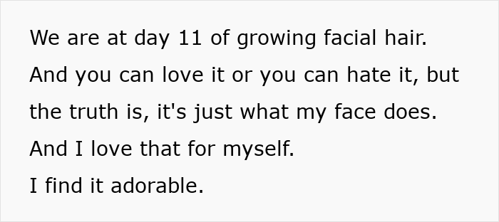 Woman with facial hair confidently embracing her look, challenging beauty stereotypes with a natural mustache on day 11.