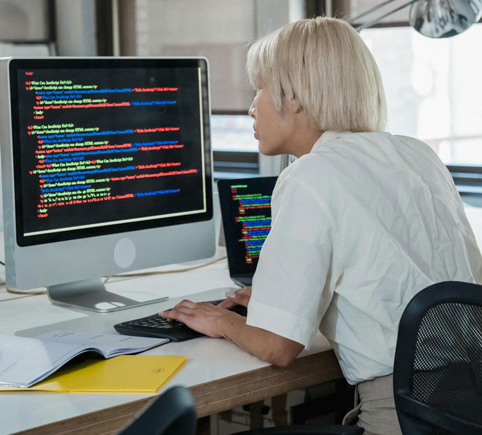 Person working on a coding interview task, realizing they got tricked during an interview while reviewing code on screen. Person working on a coding interview task, realizing they got tricked during an interview while reviewing code on screen.