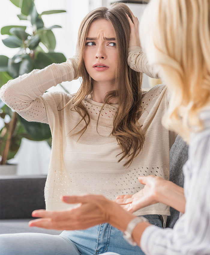 Daughter-in-law and mother-in-law tense conversation, daughter-in-law seeking relationship, conflict in family sticks together theme.