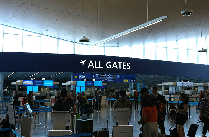 Plane passengers waiting in line at airport security control, illustrating entitled passenger cutting cue situation. Plane passengers waiting in line at airport security control, illustrating entitled passenger cutting cue situation.
