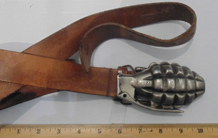 Leather belt with a g*****e-shaped buckle, an unusual item that caused problems for airport security screenings.
