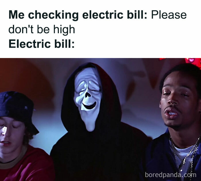 Relatable meme showing reaction to a high electric bill with a funny masked character smiling between two people.