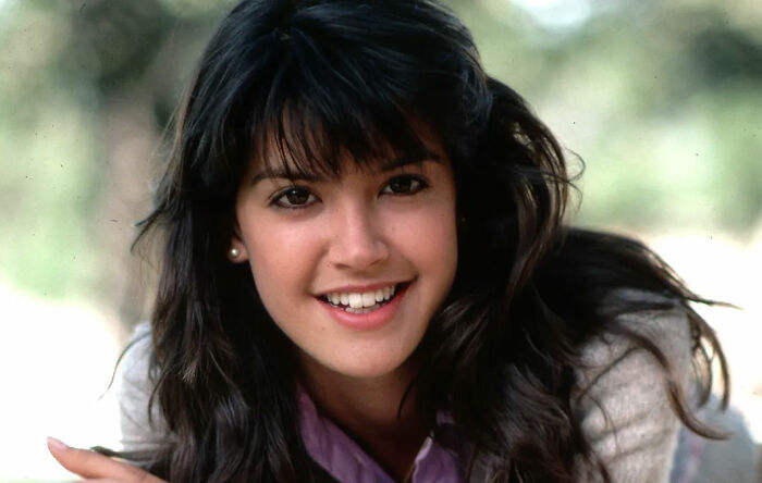 Young former Hollywood star smiling warmly outdoors, representing celebrities who left the spotlight for normal careers.