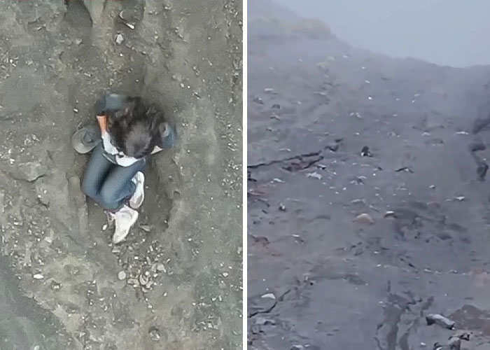 Female tourist abandoned by guide during hike on Indonesian volcano, sitting on rocky terrain looking distressed.
