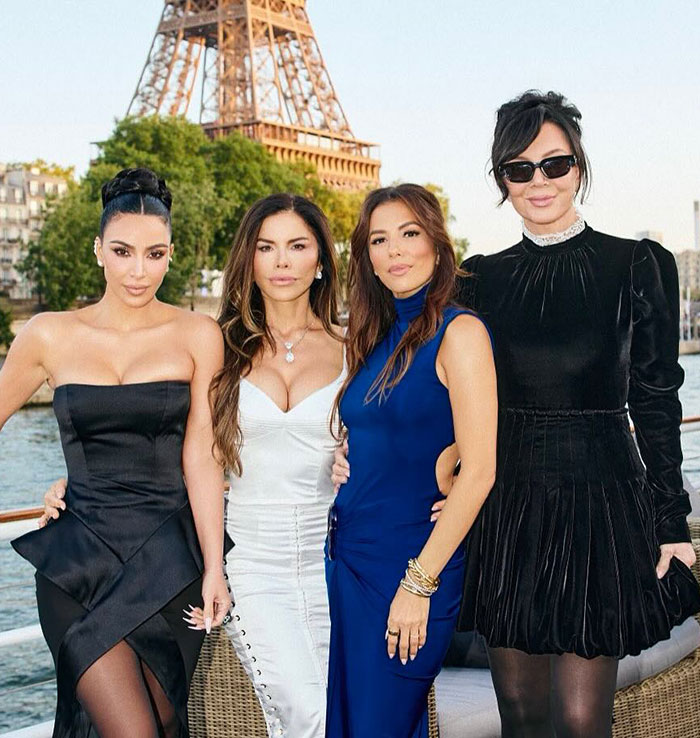 Kim Kardashian showing off her tiny waist in a black dress at Jeff Bezos' wedding festivities by the Eiffel Tower.