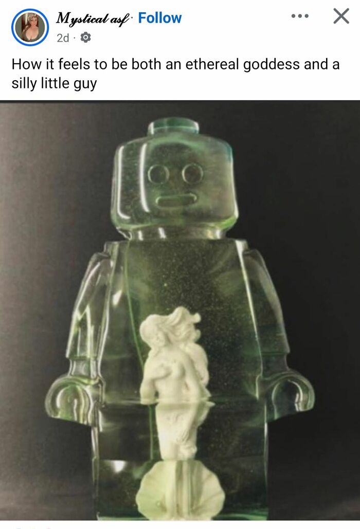 Clear resin figure resembling a Lego man with a small ethereal goddess sculpture inside, showcasing unusual craft design.