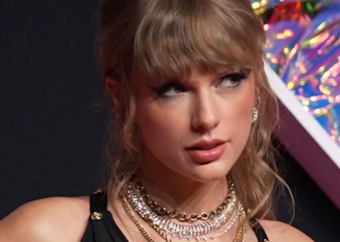 Close-up of a female celebrity wearing layered necklaces and a black top, showcasing what celebrities were doing before fame.