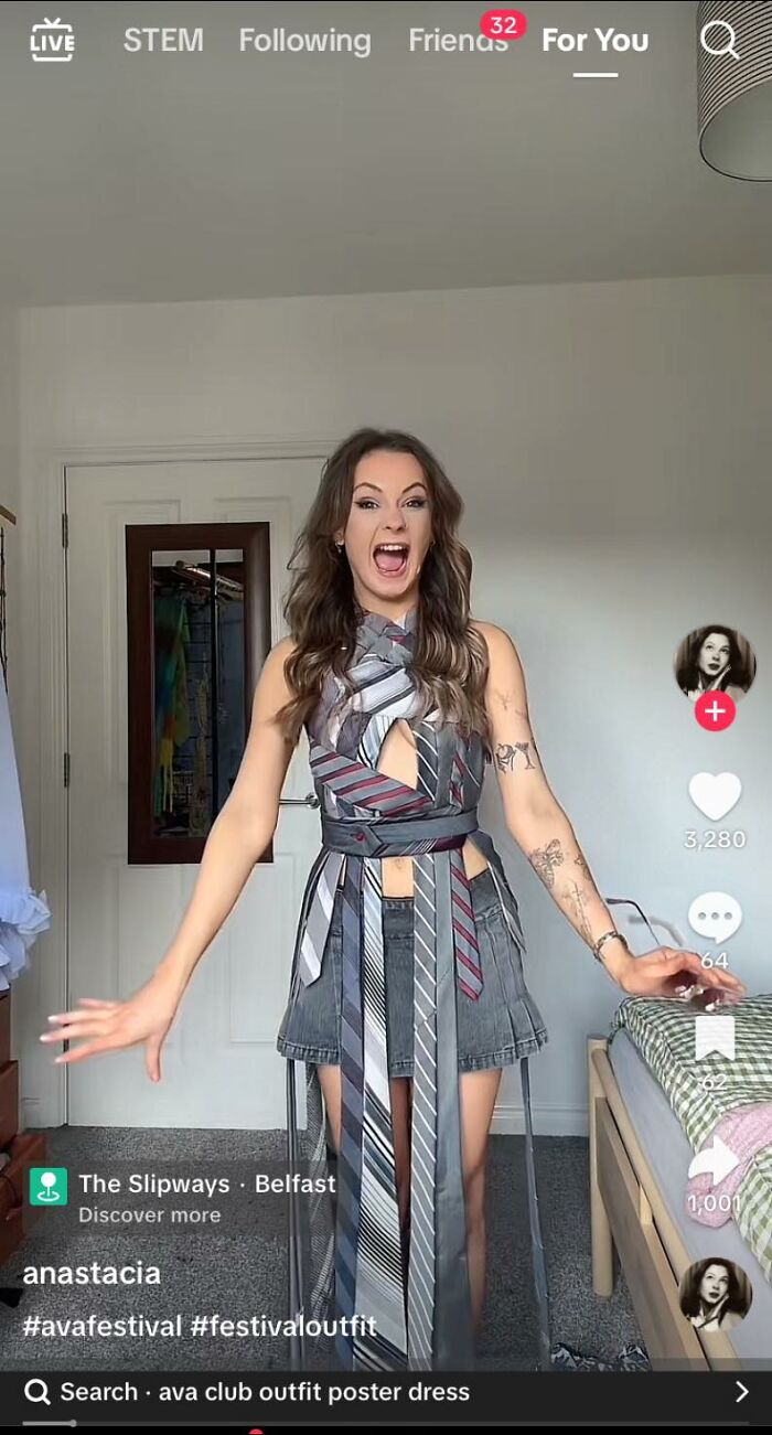 Woman wearing a DIY dress made from ties and denim shorts, showcasing a craft shaming project for horrendous DIY projects.