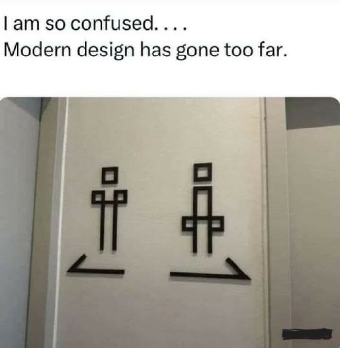 Modern design confusion with funny work meme showing abstract restroom signs on a wall.