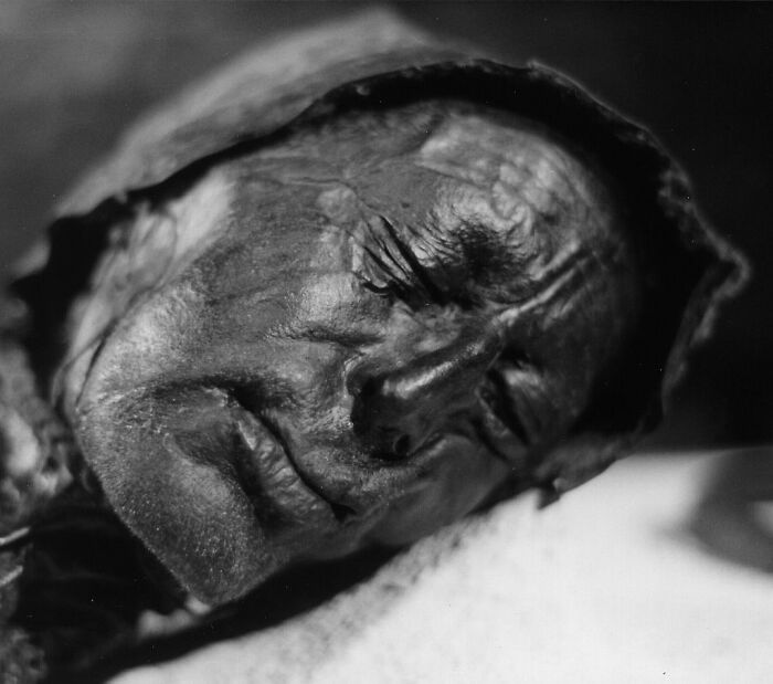 Close-up black and white photo of a preserved human face, highlighting unsettling and scary Wikipedia article subjects.
