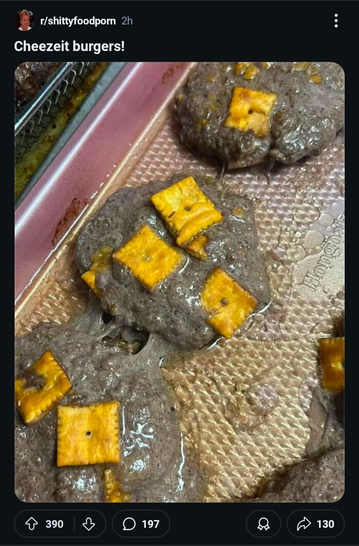 Baking tray with grayish, unappetizing patties topped with melted orange crackers, a cursed food image that looks unappealing.
