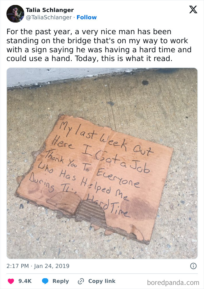 Handwritten cardboard sign on sidewalk sharing a feel-good message of hope and kindness to restore faith in humanity.