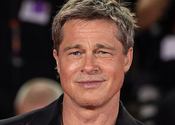 Close-up of a male celebrity at an event, illustrating what celebrities were doing before fame found them.