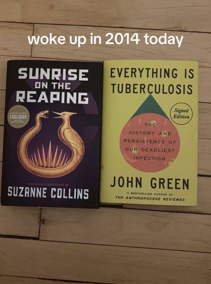 Two books on wooden floor with text woke up in 2014 today, relating to people between Millennials and Gen Z generations.