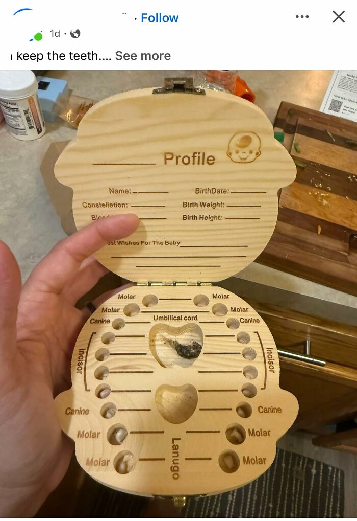 Hand holding a wooden baby tooth keepsake box with labeled slots and engraved baby profile, showcasing a DIY craft shaming fail.