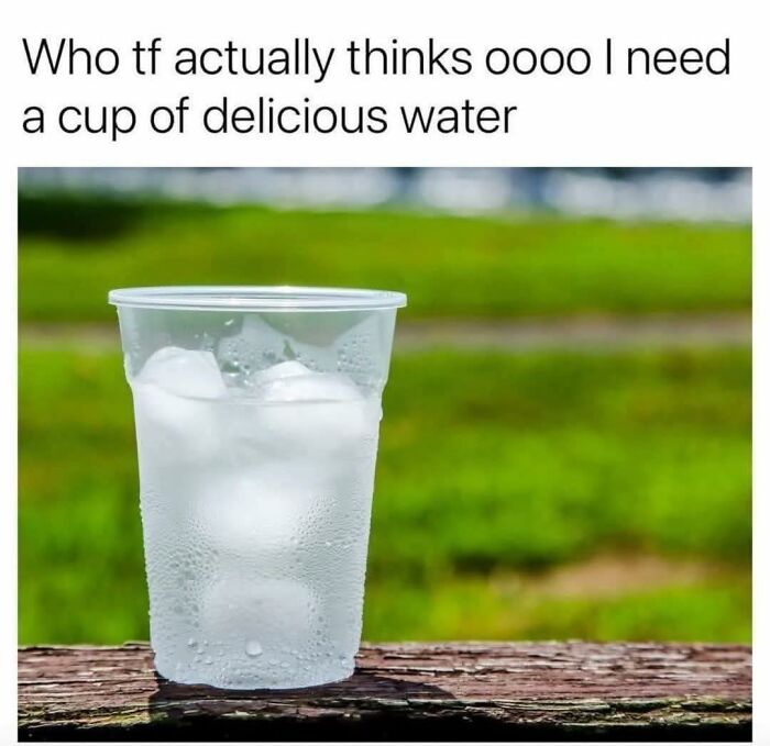 Clear plastic cup filled with ice water on a wooden surface, humorous post from funny posts collection.