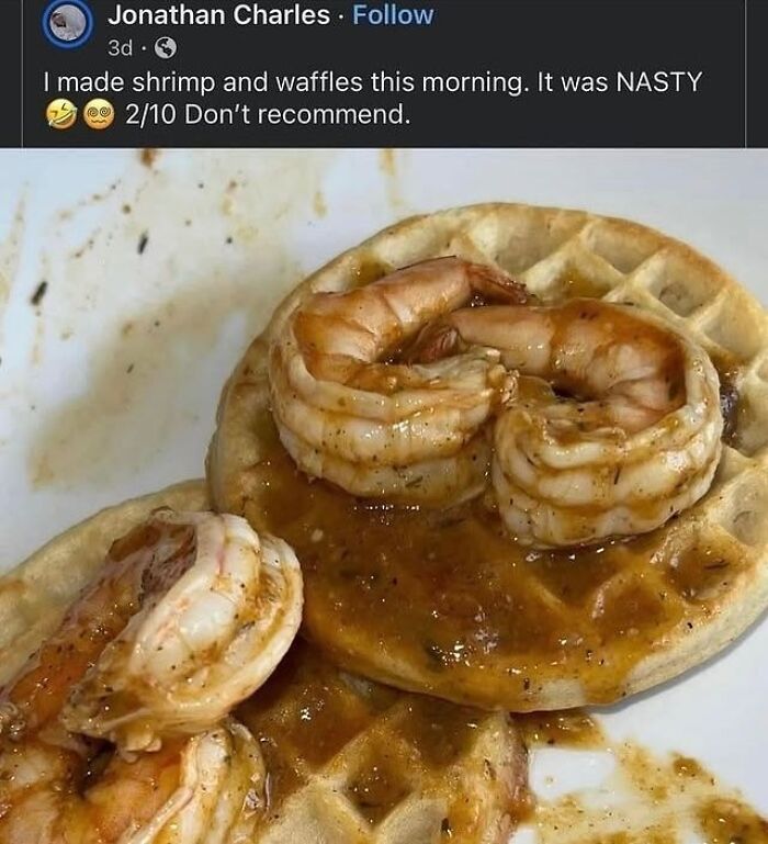 Shrimp served on waffles with a messy brown sauce, an example of cursed food pictures that might make you go eeeeeuw.
