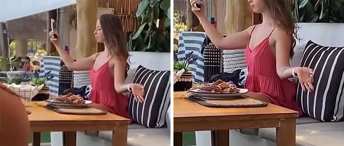 Influencer taking a selfie at a restaurant table with food, showcasing unhinged behavior for views and online attention.