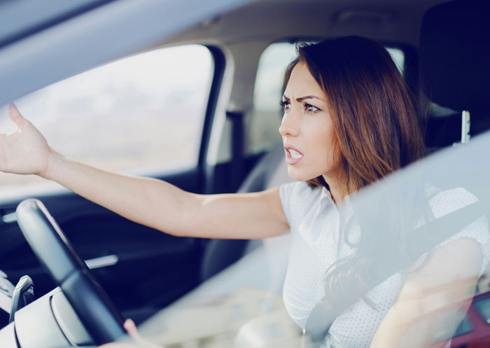 Woman in car expressing frustration, illustrating intense emotional moments similar to insane revelations in therapy sessions.